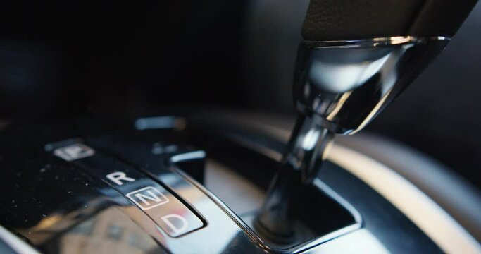 Automatic transmission, automatic gear shift, is moved from P Park to D Drive and back. Car start, starting a modern car.