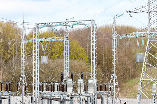 Substation line traps electric communication or high frequency stoppers, parallel resonant circuit. Metal constructions and pylons, wires, transformer high voltage electric glass insulators.