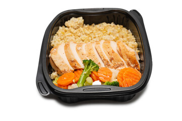 Ready food in a container. Stewed chicken, stewed carrot, cabbage and porridge.