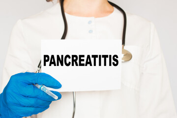 the doctor in gloves holds a card with the text PANCREATITIS . white background. the medicine