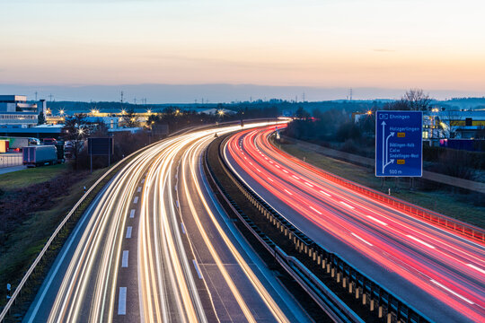 Germany, Baden-Wurttemberg, Vehicle light trails on A81 at dusk