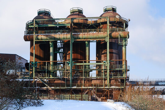 Abandoned blast furnace against sky
