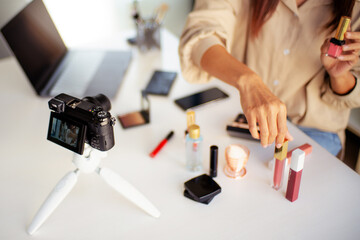 Young asian beauty blogger present cosmetics makeup broadcast live online video vlog..