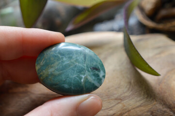 hand holding a jade mineral