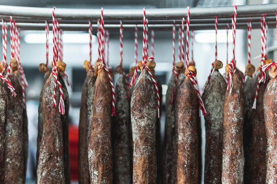 Dried ham hanging in cellar
