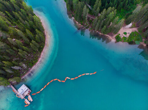 Boats moored in Pragser Wildsee lake at Dolomites, Alto Adige, Italy