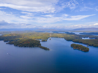 Lake Winnipesaukee and village of Weirs Beach aerial view with fall foliage in City of Laconia, New Hampshire NH, USA. 