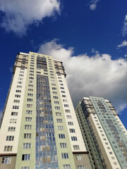 Fototapeta premium Yekaterinburg, Russia -01.05.2021: Modern residential high-rise buildings in Russia. Real estate background. Real estate market concept. Apartment building. New builded residential building. 