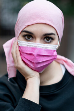 Female cancer patient with protective face mask during COVID-19