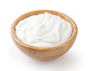 Sour cream in wooden bowl isolated on white background with clipping path