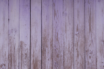 Old, cracked boards with traces of faded pale purple paint.