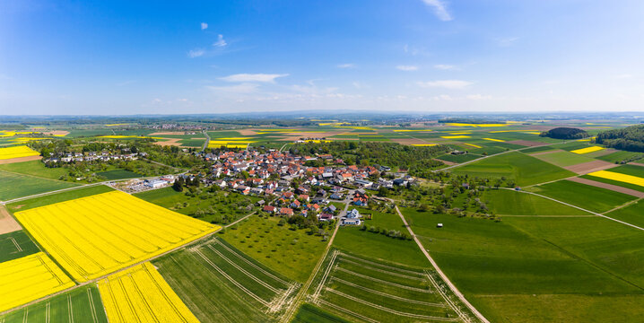 Germany, Hesse, Munzenberg, Helicopter panorama of countryside village and surrounding fields in summer