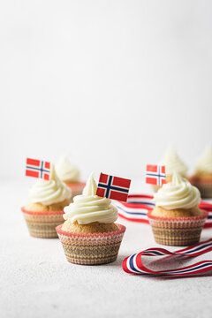 A photo of muffins with Norwegian flag to Norwegian Independence day or for birthday