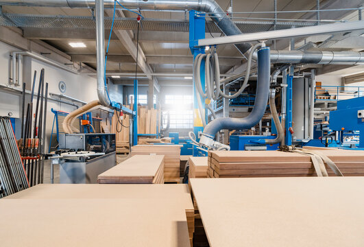 Wood plank by machinery at industry