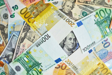 Money. Euro cash and U.S. dollars banknotes.