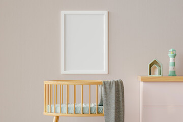 Three dimensional render of blank picture frame hanging on wall over empty crib