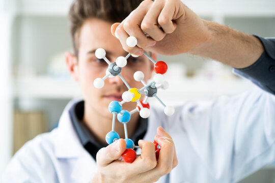 Male scientist working with molecular structure in laboratory