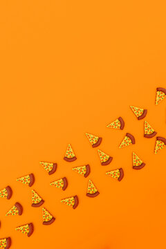 Three dimensional render of pizza slices on orange background