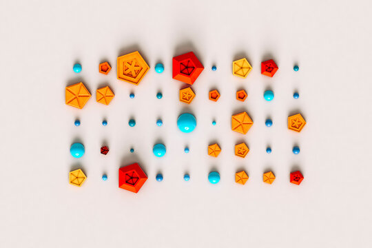 Studio shot of rows of colorful pentagons, spheres and hemispheres