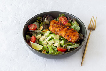 Salad with chicken, avocado and tomatoes. Healthy eating. Vegetarian food.