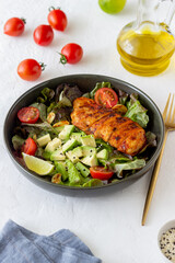 Salad with chicken, avocado and tomatoes. Healthy eating. Vegetarian food.