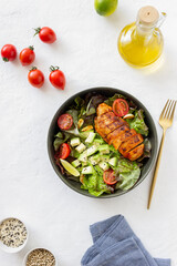 Salad with chicken, avocado and tomatoes. Healthy eating. Vegetarian food.