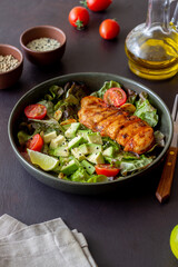 Salad with chicken, avocado and tomatoes. Healthy eating. Vegetarian food.