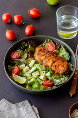 Salad with chicken, avocado and tomatoes. Healthy eating. Vegetarian food.