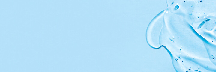 Transparent hyaluronic acid gel on a blue background.