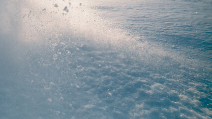 snow splash in the air, blue sky background