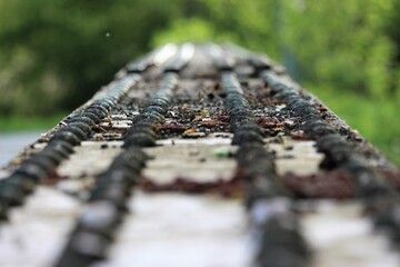 Bokeh focus of rusted rivets on metal bridge