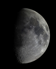 Sharp telescope view of Waxing Gibbous Moon in night sky