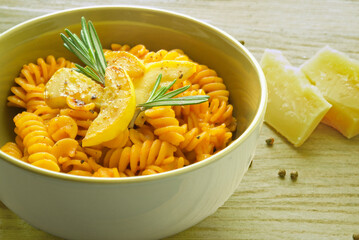 Italian Fusilli Pasta Bowl and tomato Sauce, covered with slices of Zuchinni , Rosemary, Black Pepper and Parmesan Cheese. 