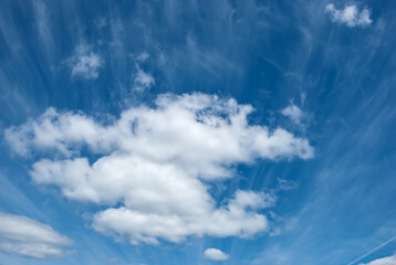 Heap white clouds in a clear blue sky.