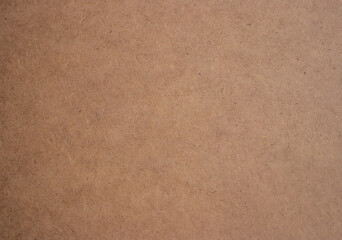 Fototapeta na wymiar Recycled paper texture, cardboard texture closeup, horizontal wooden surface