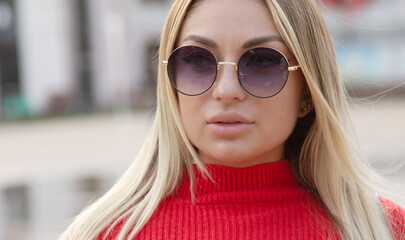 Beautiful young woman in sunglasses. Outdoor portrait. Summer time.