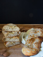 Typical Catalan sweet with bread dough, sugar and almonds or pine nuts.