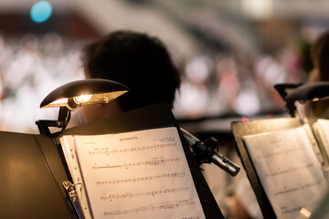 A close-up of the musician's notes placed on the platform and illuminated for clear visibility...