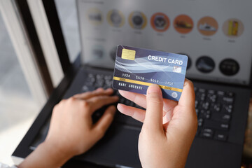 woman holding credit card and use laptop for with shopping online. Online payment concept. - Image