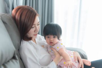 Mother and daughter newborn in home,Happy time of family,Single mom concept,Concept mother day