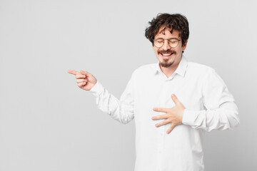 young handsome man laughing out loud at some hilarious joke
