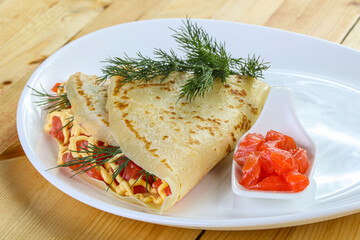 Pancake with salmon fiilet and cheese