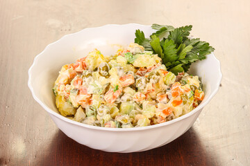 Russian traditional salad with green peas