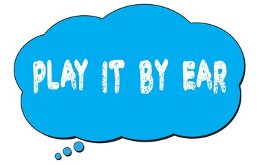 PLAY  IT  BY  EAR text written on a blue thought bubble.