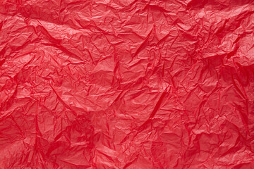 Fototapeta premium Red crumpled paper or sheet texture background for Design. Wallpaper for text. Copy space.
