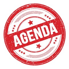 AGENDA text on red round grungy stamp.