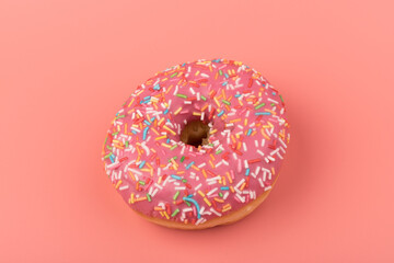 Fresh made Donuts isolated on pink background. Doughnuts are traditional sweet pastries. Copy space for text.