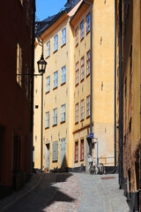 Stockholm Old town narrow alley with apartment  buildings.