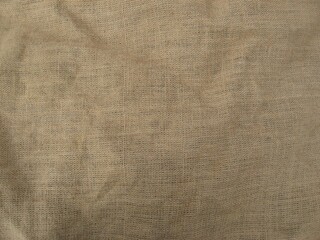 Fototapeta premium Beige crumpled sackcloth texture