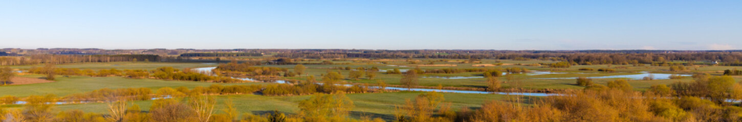 Fototapeta na wymiar Early spring panoramic view of Narew river valley wetlands and nature reserve seen from Gora Strekowa hill near Wizna in Podlaskie voivodship in Poland